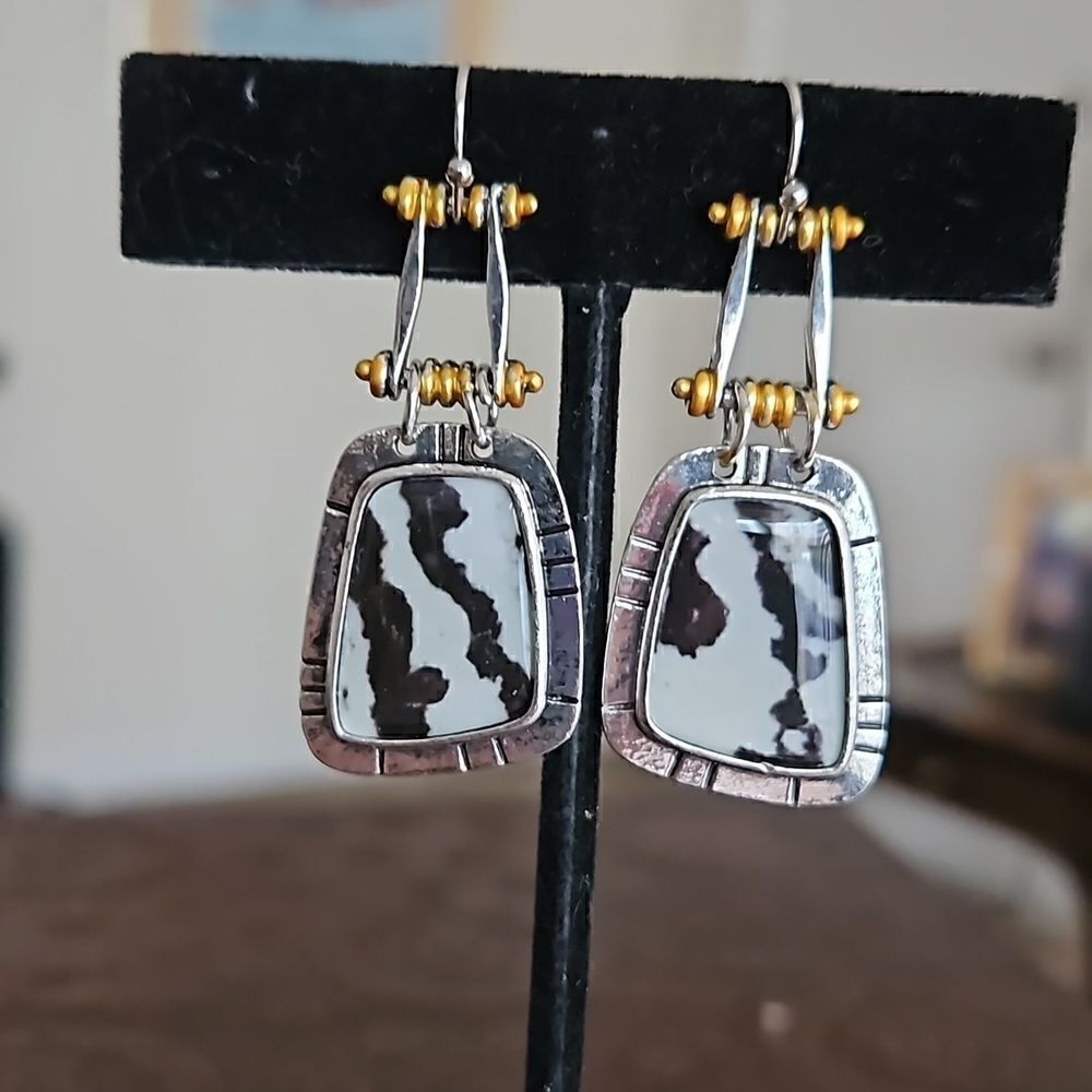 Asymmetric black and cream and gold toned drop earrings